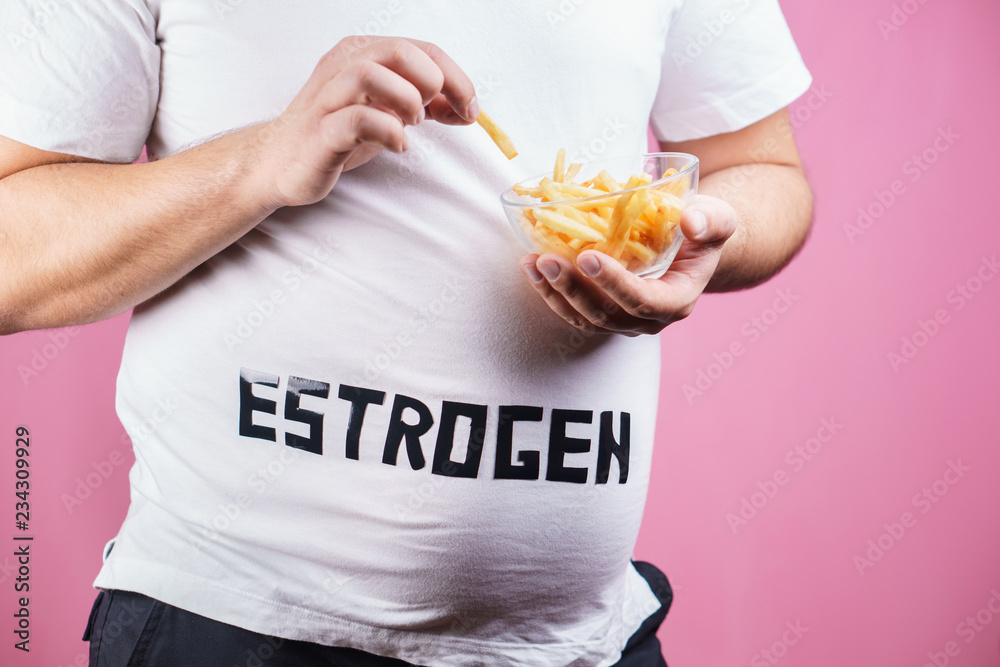 weight gain, fast food, hormonal imbalance, estrogen level. overweight man belly with french