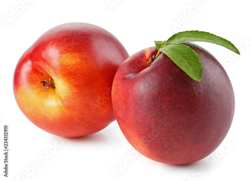 Peaches or nectarines with leaf on white background