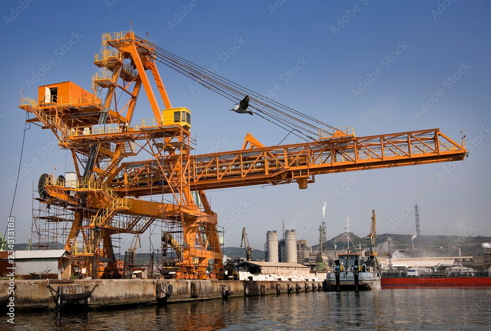 A shot of a yellow ship crane