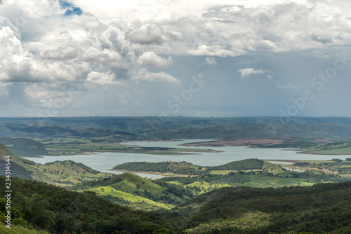 Landscape of mountains with dammed lake in the region of Minas Gerais, Brazil photo