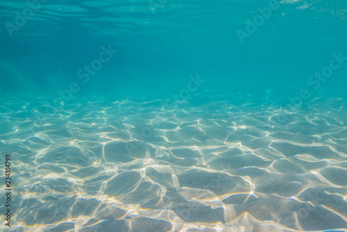 Underwater with sand and sunlight