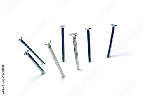 group of nails pegged on white background isolated