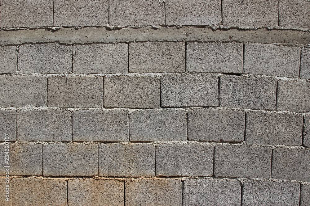 Fototapeta premium Grey brick wall close up detail