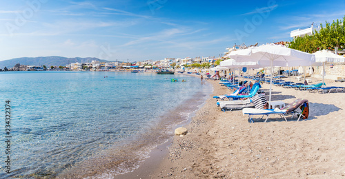 Sun beds and sun shades in Haraki beach      Rhodes  Greece 