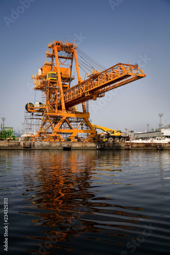 A shot of a yellow ship crane