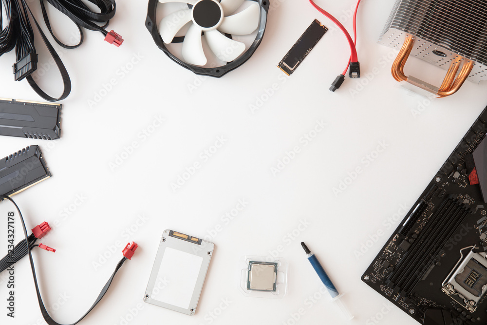 Top view of parts and accessories, Electronics repair and upgrade on white desk background, copy space. Motherboard, processor cpu, cooler, radiator, flat lay. Stock Photo Adobe Stock