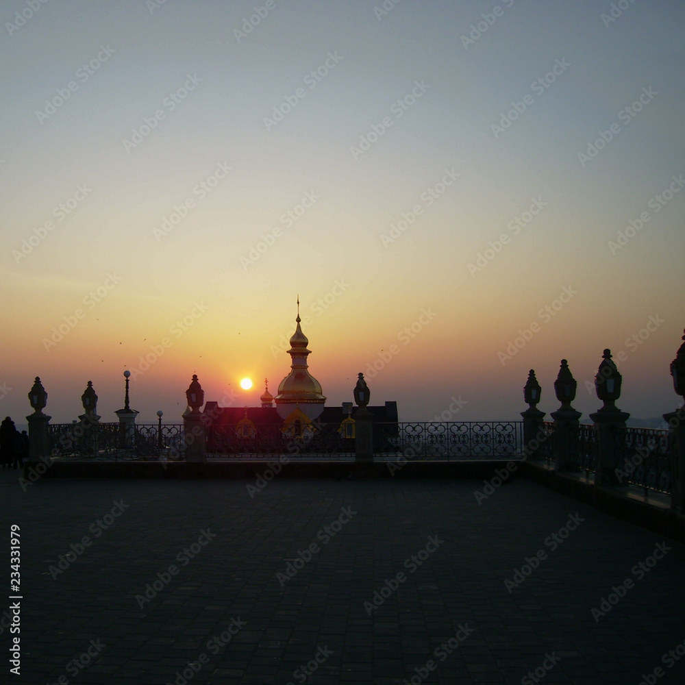Fototapeta premium Sunset and dome of the church.