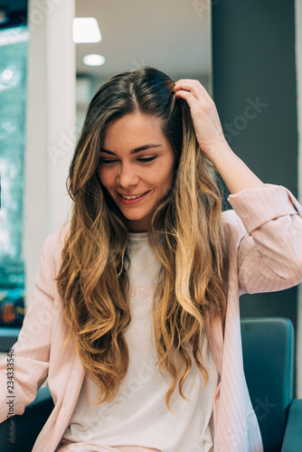 Woman with long hair sittin...