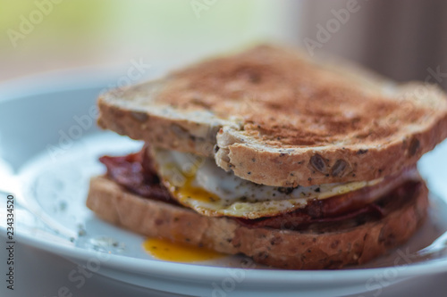 Homemade Breakfast Egg Sandwich with Cheese and bacon on Toast