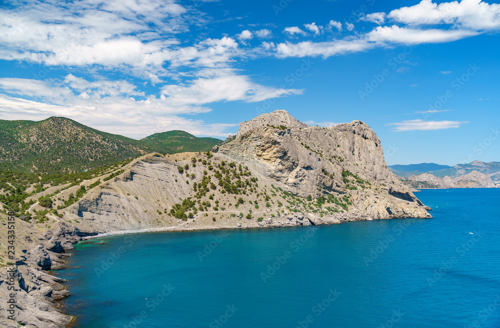 Sea aerial view, Top view, amazing nature background.The color of the water and beautifully bright. Azure beach with rocky mountains and clear water of Crimea at sunny day