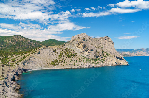 Fototapeta Naklejka Na Ścianę i Meble -  Sea aerial view, Top view, amazing nature background.The color of the water and beautifully bright. Azure beach with rocky mountains and clear water of Crimea at sunny day