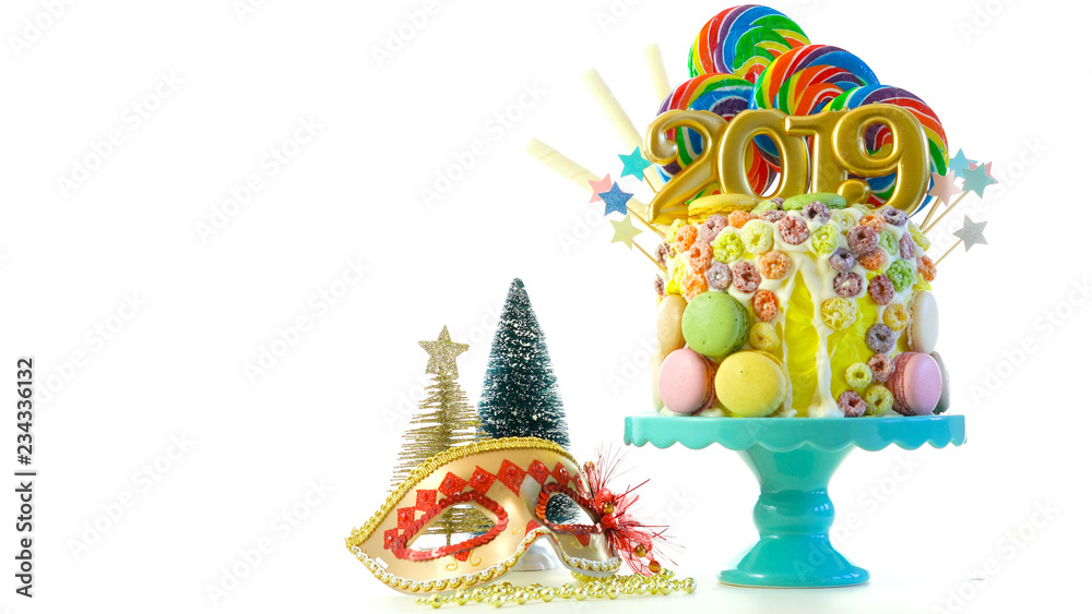 Happy New Year's candy land lollipop drip cake with 2019 candles on white background. Happy New Year's candy land lollipop drip cake with 2019 candles on white background.