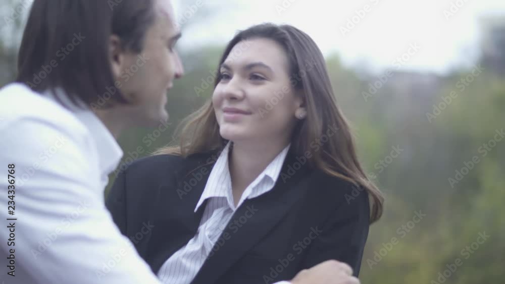 Female comes and covers eyes of her boyfriend with her hands outdoors Guy and girlfriend spending time together Couple in love Happy couple Female comes and covers eyes of her boyfriend with her hands outdoors Guy and girlfriend spending time together Couple in love Happy couple