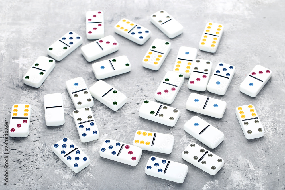 Dominoes on grey wooden table Dominoes on grey wooden table
