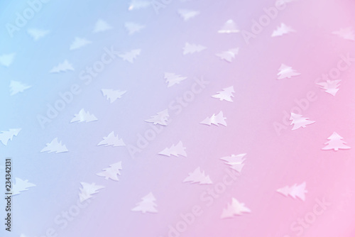 Colorful celebration background with party confetti on pastel blue background.