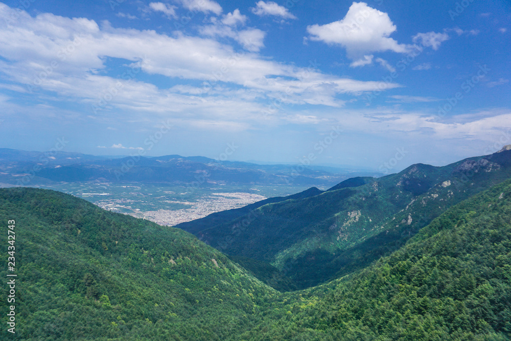 Aerial view of the green mountains of Uludag while climbing