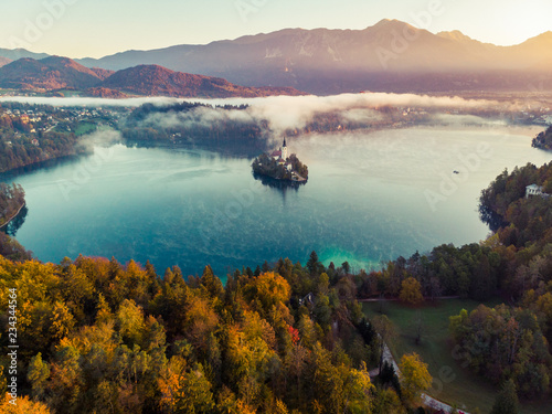 Magic sunrise over foggy Blad lake and castle Slovenia