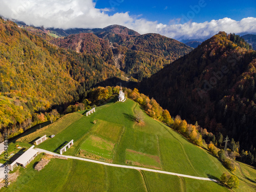 Aerial view of rural church or chapel in Slovenia at autumn photo