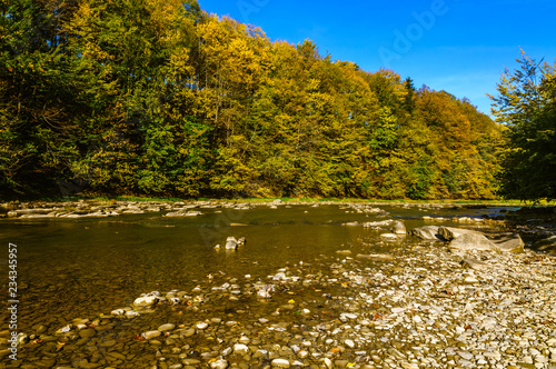 Bieszczady Mountains, Rajskie Poland, San river, view on streem in sunny autumn day.  photo