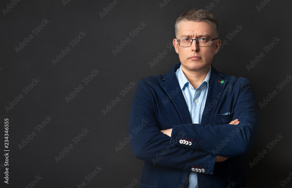Businessman in a bad mood in the Studio
