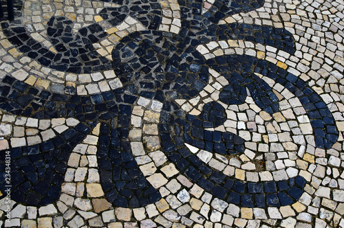 Stone mosaic on the street of Lisbon