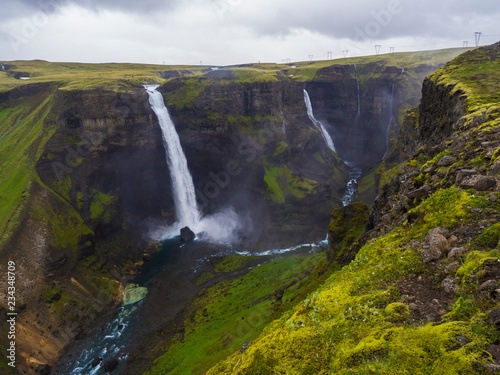 Valley of river Fossa with Beautiful Haifoss waterfall in South Iceland  summer moody sky