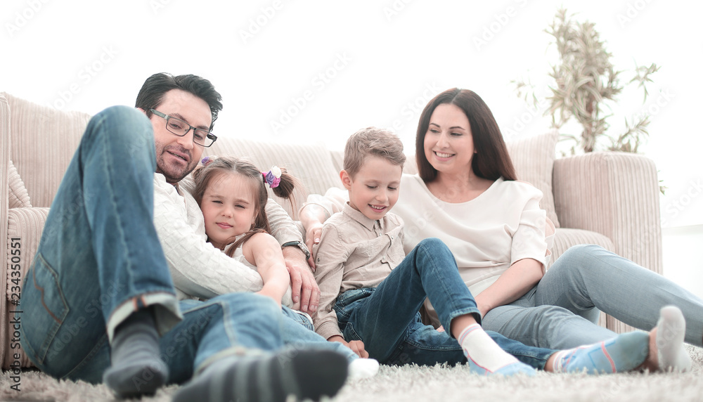 happy family rests in the living room on a free evening