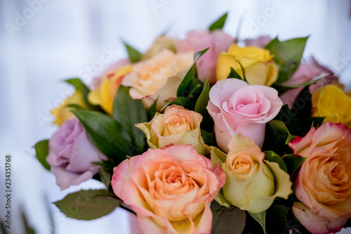 Colorful roses  beautiful flower bouquet.happy mother s day.Mix color roses in the box.pile of pink  yellow  orange  red  and white fresh roses isolated.round bouquet of multicolored roses
