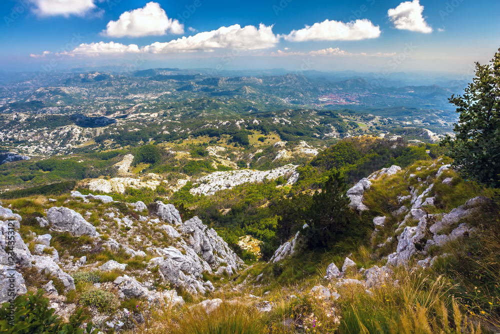 Panoramic view of a mountain valley near the town of Cetinje on a summer sunny day from the top of the mountain.  Vidikovac, Lovcen National Park, Montenegro.