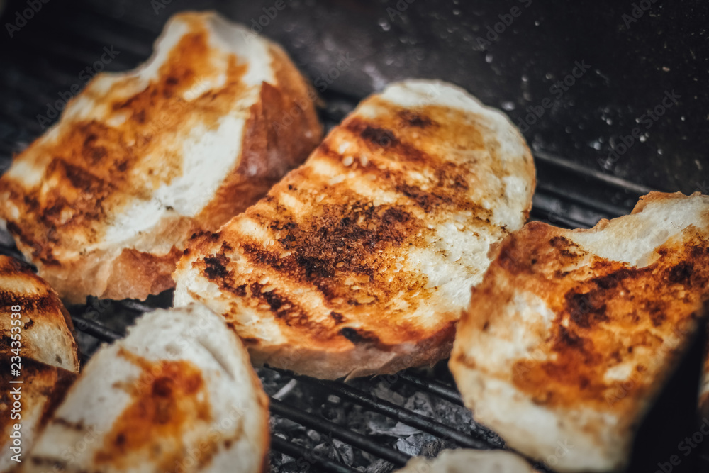Bread with pepper sauce on the grill, barbecue weekend with friends in nature, outdoor activity Bread with pepper sauce on the grill, barbecue weekend with friends in nature, outdoor activity