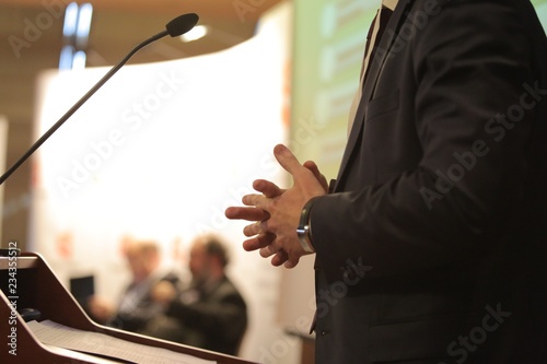 Hands closeup. Speaker giving talk on podium at Business Conference. Entrepreneurship club.