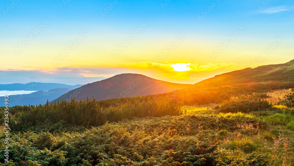 Sunrise at the top of Carpathian mountains, awesome nature landscape in the morning