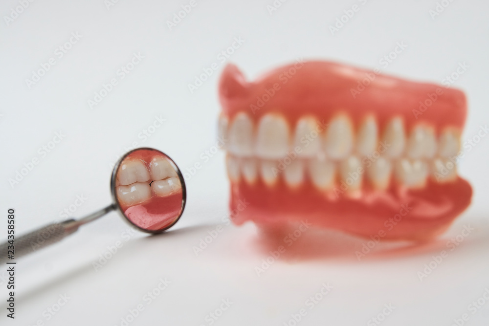 Artificial teeth on a white background with copy space. Artificial teeth on a white background with copy space.