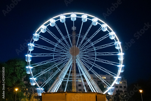 Biggest Ferris wheel in Brno, Czech Republic in Moravske square during set up for Christmas event captured at night time