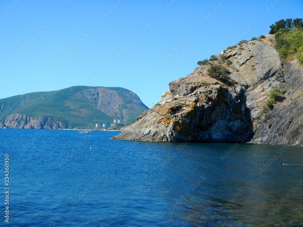 Fototapeta premium Beautiful view from the sea to the rock