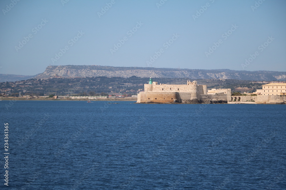 View to Castello Maniace in Ortigia Syracuse  from Mediterranean sea, Sicily Italy 

