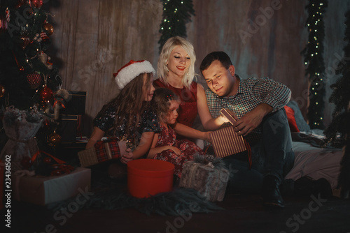 Christmas Family Open Present Gift Bag, Looking to Magic Light in Night Xmas Tree loft Interior © oes