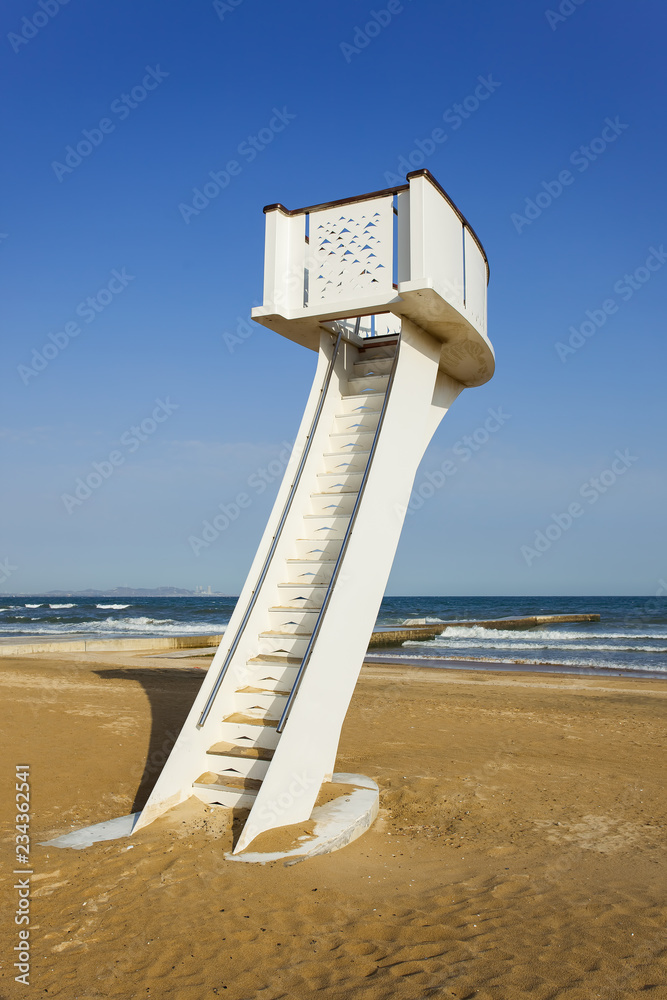 Watchtower on a sunny beach with a blue cloudy sky Watchtower on a sunny beach with a blue cloudy sky