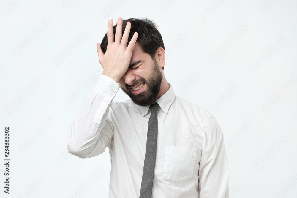Hispanic man hold his head in hand forgotten something Hispanic man hold his head in hand forgotten something
