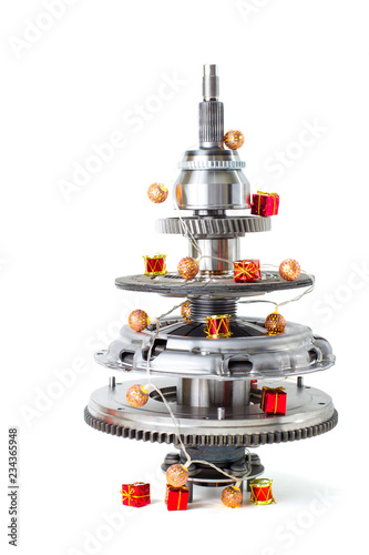 Abstract christmas tree of car parts on a white background. Decorated with Christmas toys, garland