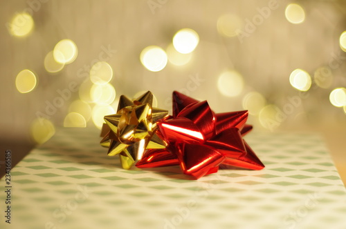 Gold and red ribbons on ornamental gift box