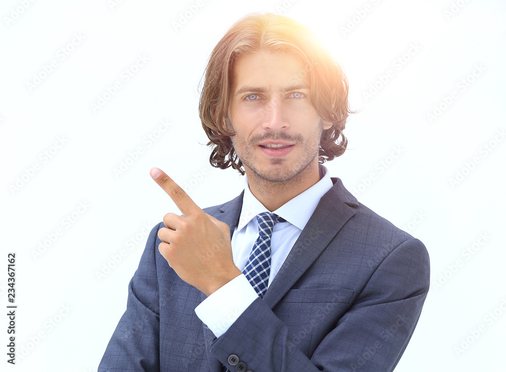 a young and handsome businessman pointing up with his finger a young and handsome businessman pointing up with his finger