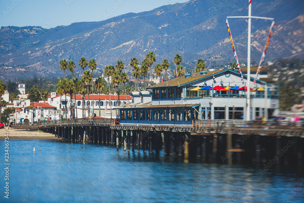 Beautiful view of Santa Barbara ocean front walk, with beach and marina, palms and mountains, Santa Ynez mountains and Pacific Ocean, Santa Barbara county, California, United States, summer sunny day
