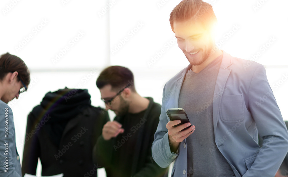 designer with mobile phone on background creative Studio designer with mobile phone on background creative Studio