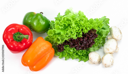 lettuce, bell pepper and mushrooms on a white background