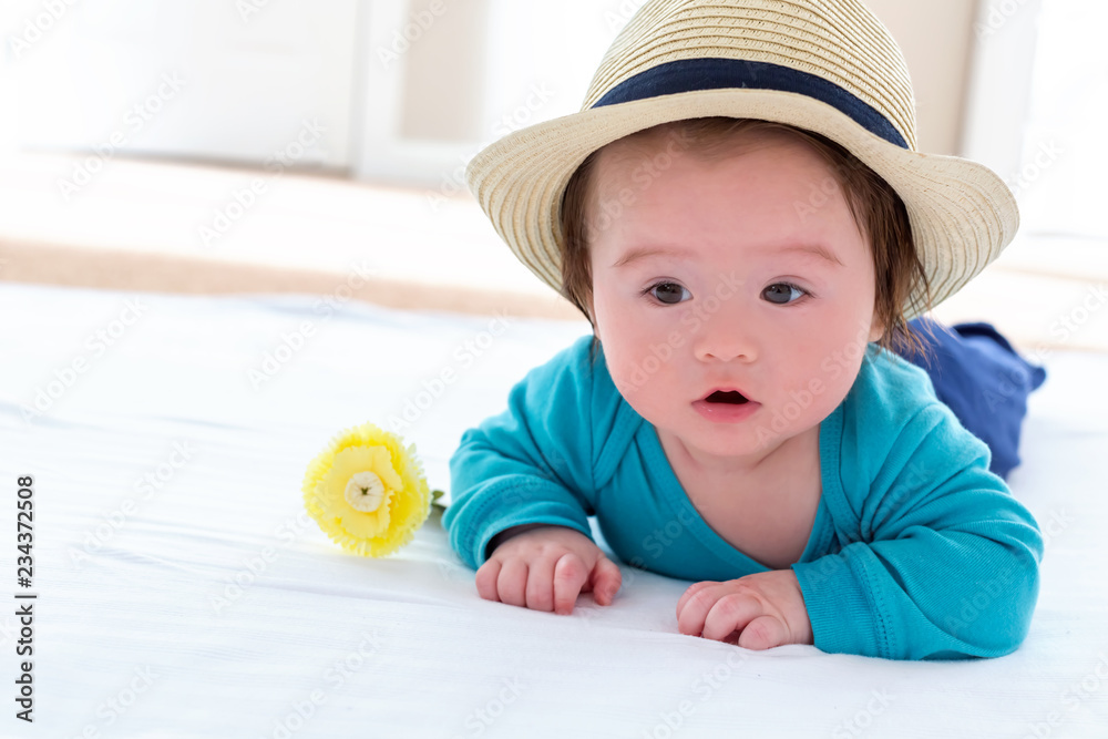 Cute little multi-ethnic baby boy with flowers Cute little multi-ethnic baby boy with flowers