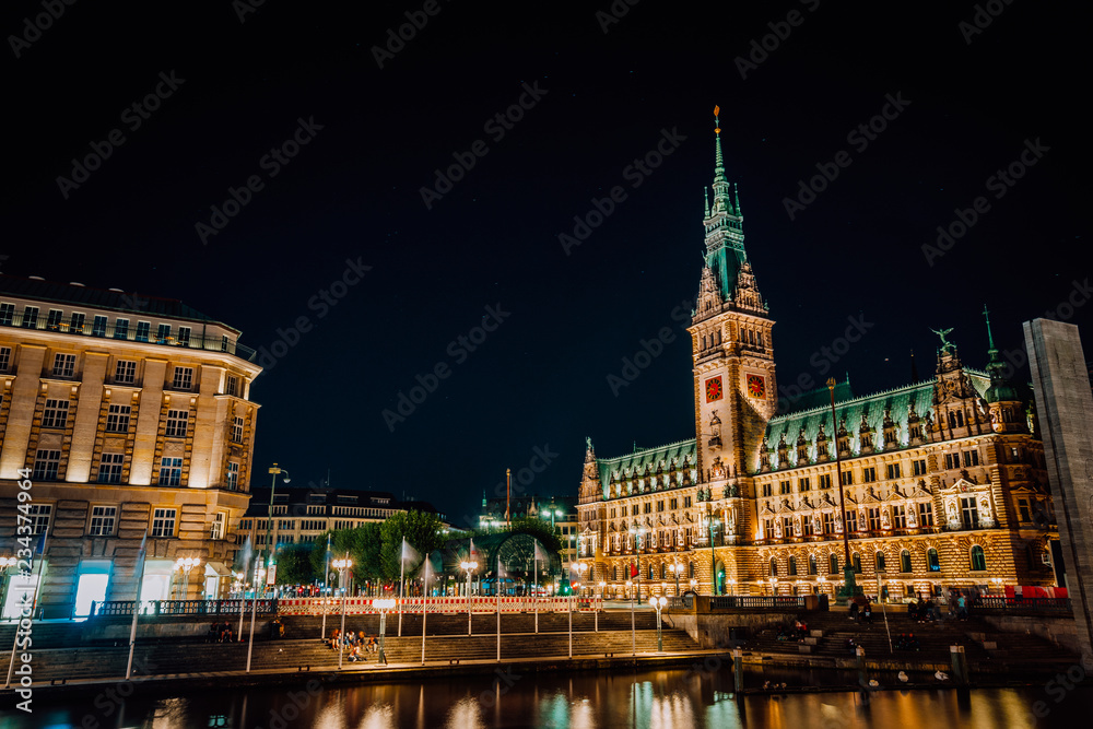 Hamburg Rathaus City Hall at night. Long exposure shot of illuminated building and city square. Urban panorama, Germany