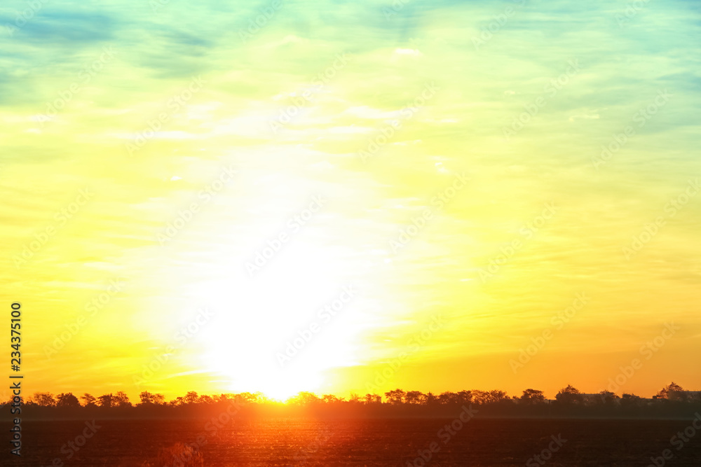 Picturesque view of beautiful sky lit by setting sun Picturesque view of beautiful sky lit by setting sun