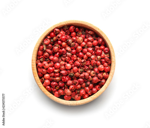 Bowl with red peppercorns on white background, top view
