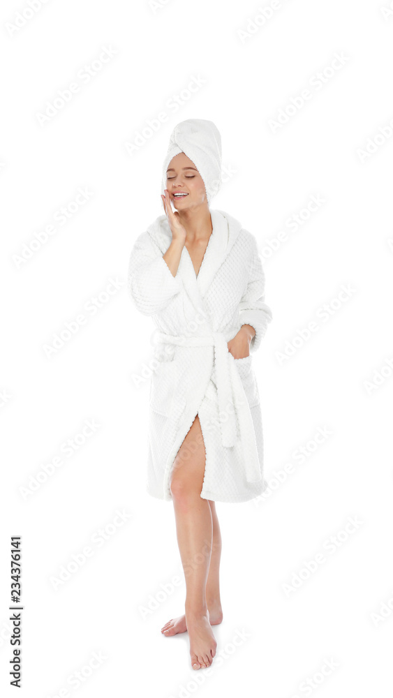 Full length portrait of young pretty woman in bathrobe with towel on white background Full length portrait of young pretty woman in bathrobe with towel on white background